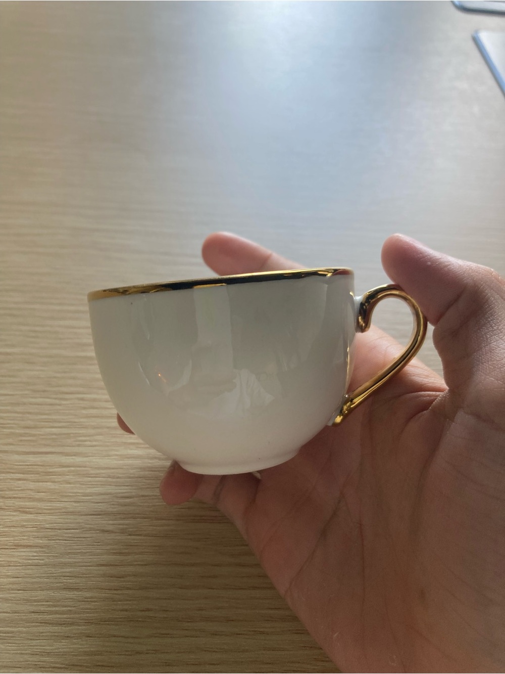 Elegant White Porcelain Teacup with Gold Trim
